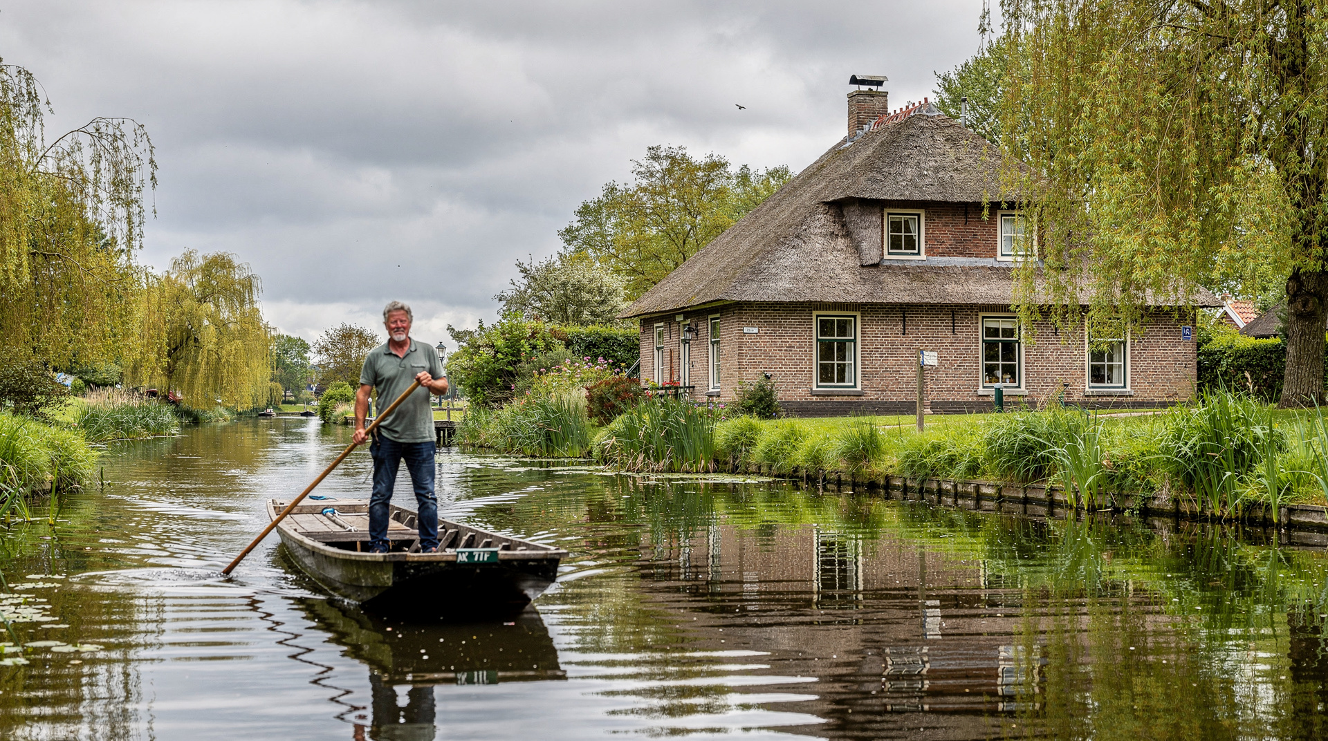 Giethoorn: the car-free village of canals and reed thatched farmhouses